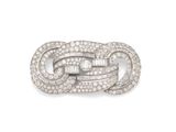 une broche en diamants et plaquée platine, signée Cartier