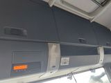 a view of the inside of an airplane with the door open