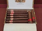 a box of five cigars sitting on top of a table