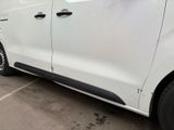 a white van that is parked in a parking lot