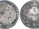 a close up of a coin with a man ' s face on it