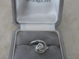 a ring that is sitting in a box on the floor