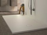 a bathroom with a shower and a sink in it