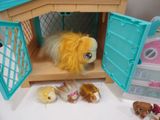 a stuffed animal that is inside of a doll house