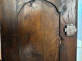 a picture of an old wooden cabinet with a door