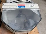 two microwaves sitting on a pallet in a warehouse