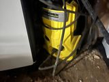 a yellow bucket that is sitting on the ground