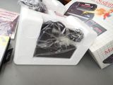 a box of nintendo game controllers and a box of games