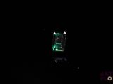 an image of a green light in the dark