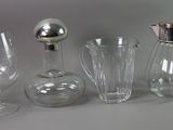 four different types of glassware sitting on a table