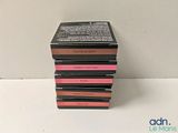 a stack of four lipsticks sitting on top of each other