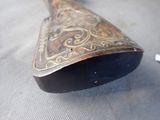a wooden spoon with a metal handle on a table
