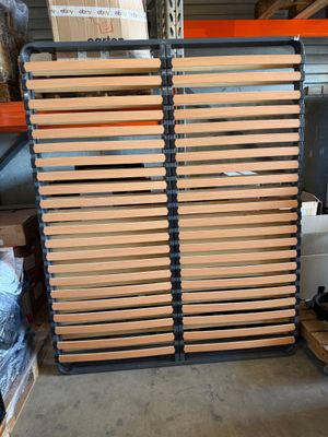 several wooden slats stacked on top of each other in a warehouse