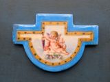 a blue cross with a picture of a baby on it
