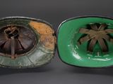 pair of green and brown bowls with a flower design on them