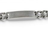 a close up of a metal bracelet with a chain on a white background