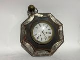 a clock that is hanging on the wall in the room