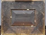 a picture of an old camera with a wooden frame