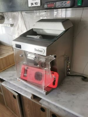 a counter top with a blender on it in a kitchen