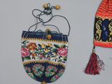 a purse and a hat hanging on a wall
