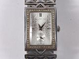 an image of a close up of a wrist watch on a white surface