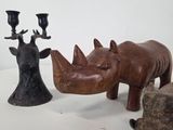 three different animal figurines sitting on a table