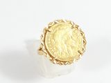 an image of a gold ring with a roman coin in the center