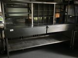 a kitchen with stainless steel cabinets and a window
