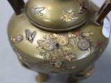 a gold tea pot with flowers and butterflies on it