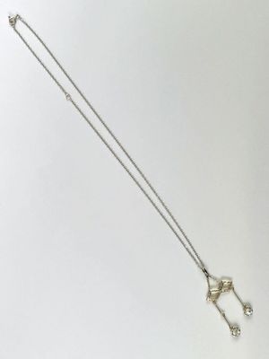 Négligé en or blanc 750 millièmes dont le motif losangique s…