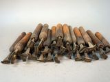 a pile of old wooden dows on a white surface