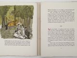 an open book with a picture of a man and a woman in the woods