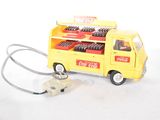 a yellow toy truck with a stethoscope attached to it
