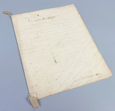 a piece of paper with writing on it sitting on top of a table