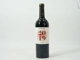 a bottle of wine that is sitting on a table