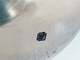 a small piece of metal on the bottom of a metal pan