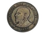 an old coin with a portrait of a man on it