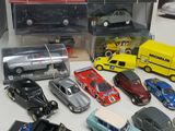 a lot of toy cars that are sitting on a table