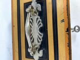 a picture of a door handle on a wooden door
