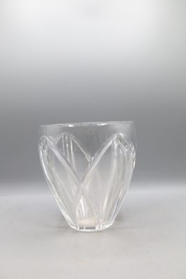clear glass bowl on a white surface with a light in the background