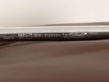a close up of a baseball bat laying on a bed