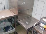 a small kitchen with a sink and a stove in it