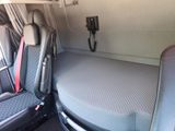 a small bed in the back of a van