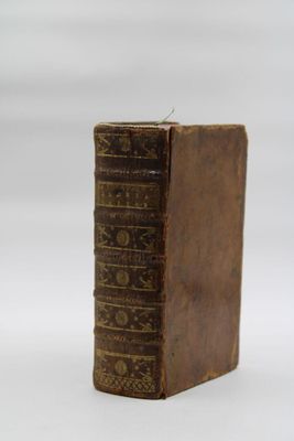 a small book sitting on top of a white table