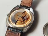 a watch that is sitting on a table next to a watch
