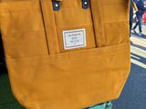 a bag that is sitting on top of a suitcase