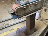 an image of a machine that is working on a piece of metal