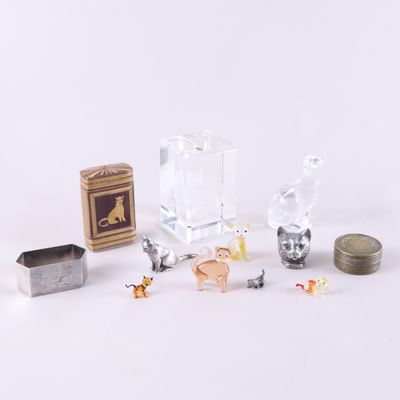 a small collection of miniature animals and a box of coins