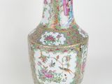 a vase that is sitting on a white surface