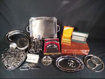 a lot of silver items on a black table